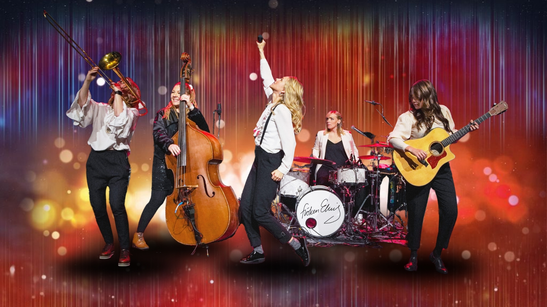 Band of five performing on stage with trombone, upright bass, vocals, drums, and guitar against a colorful bokeh backdrop.